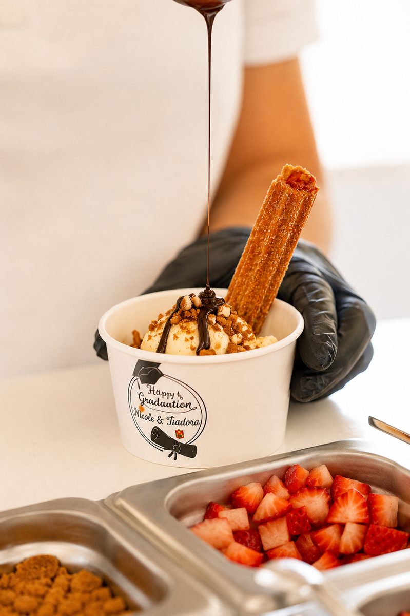 Chocolate being poured over a Geli Snacks churro sundae
