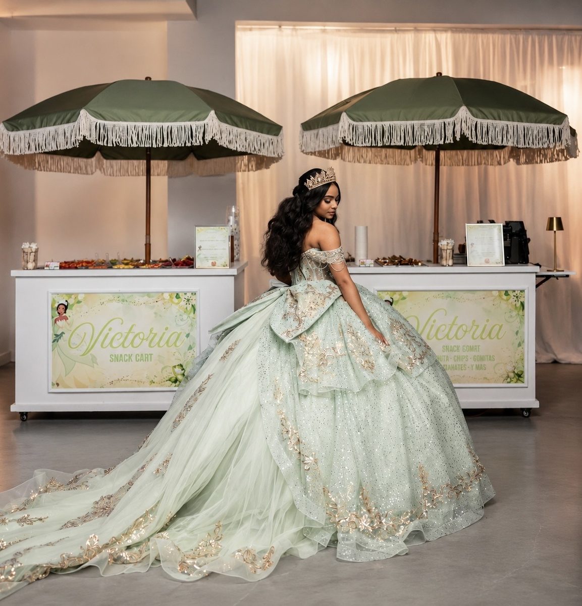 Quinceañera in a sage green gown between two branded Geli Snacks carts