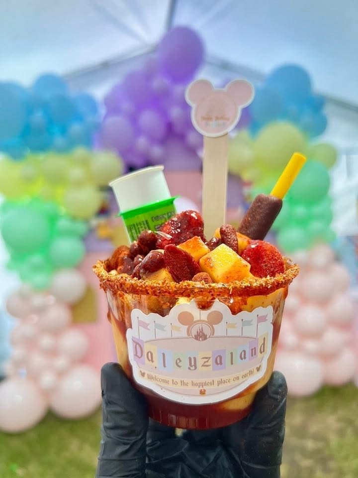 Mangonada cup with mango, chamoy and a tamarind candy stick