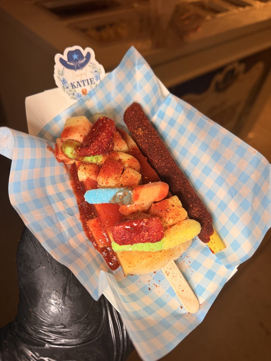 Loaded paleta popsicle with chamoy, gummy worms and fresh fruit